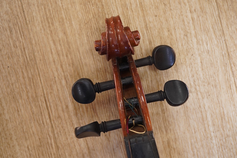 A cased students violin